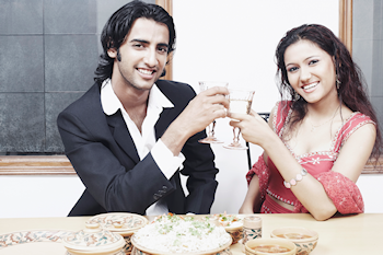 Indian couple toasting cheers to each other